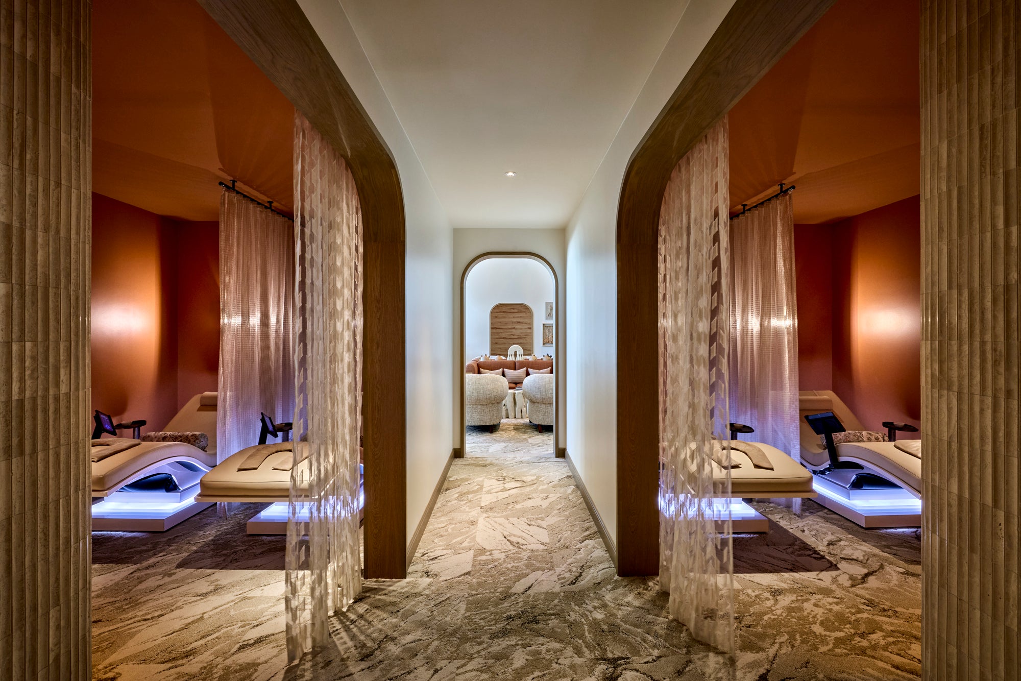 The stillness lounge at the Spa at JW Marriott Camelback Inn offers Mind-Sync Harmonic Wellness Loungers, weighted blankets, eye masks, and noise-canceling headphones designed to reduce stress and improve sleep.