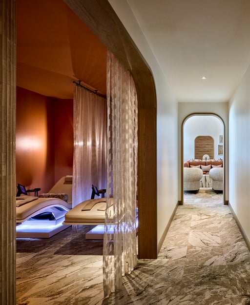The stillness lounge at the Spa at JW Marriott Camelback Inn offers Mind-Sync Harmonic Wellness Loungers, weighted blankets, eye masks, and noise-canceling headphones designed to reduce stress and improve sleep.