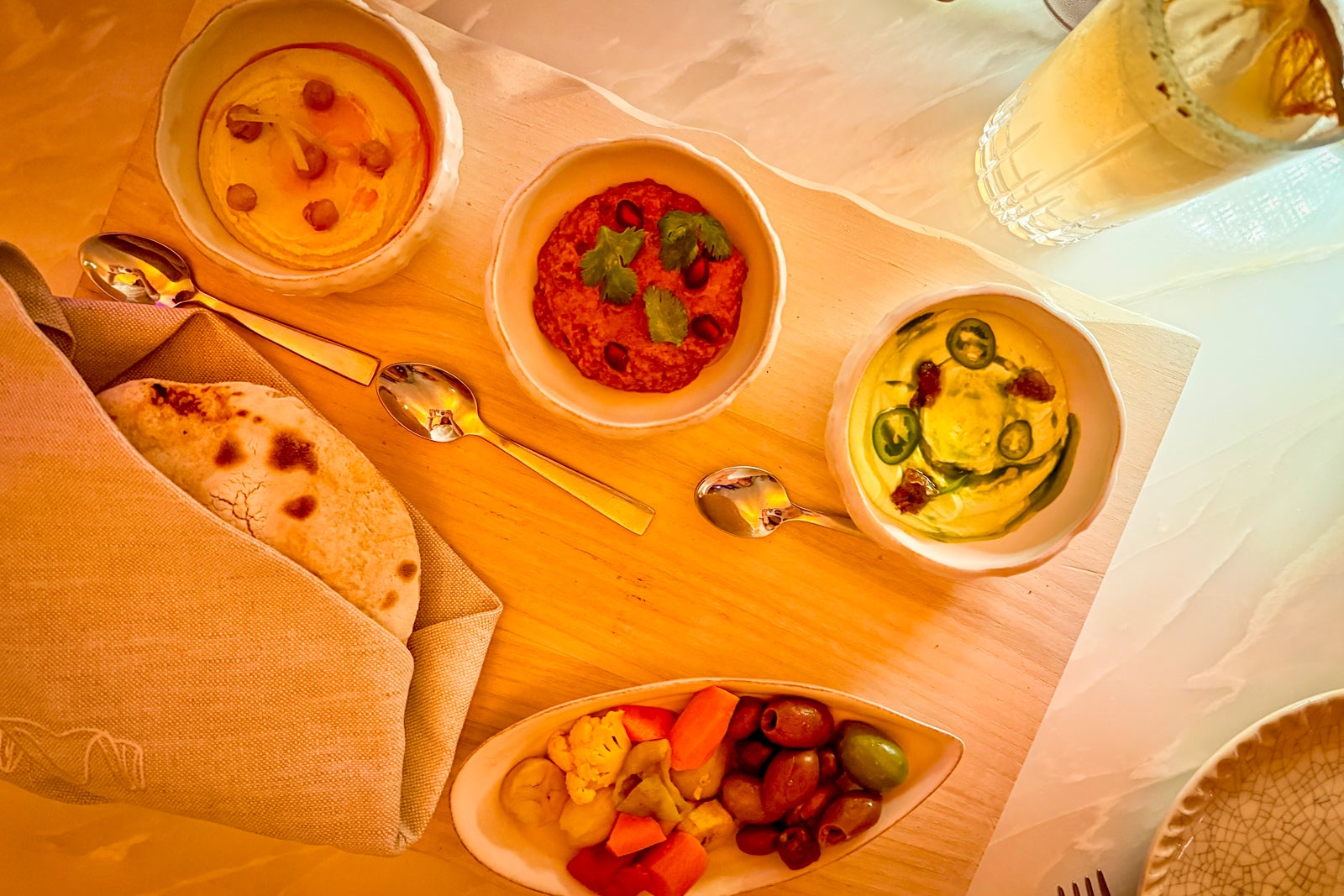 dips and bread on a table