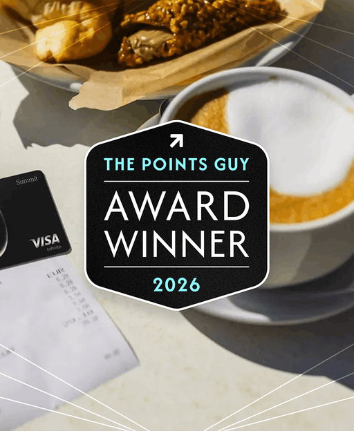Atmos Rewards Summit card on a table with coffee cup