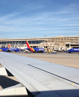 Southwest Airlines planes taxiing and at airport gates