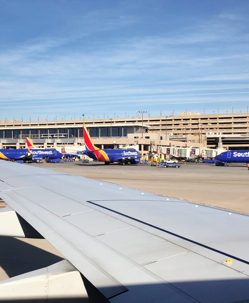 Southwest Airlines planes taxiing and at airport gates