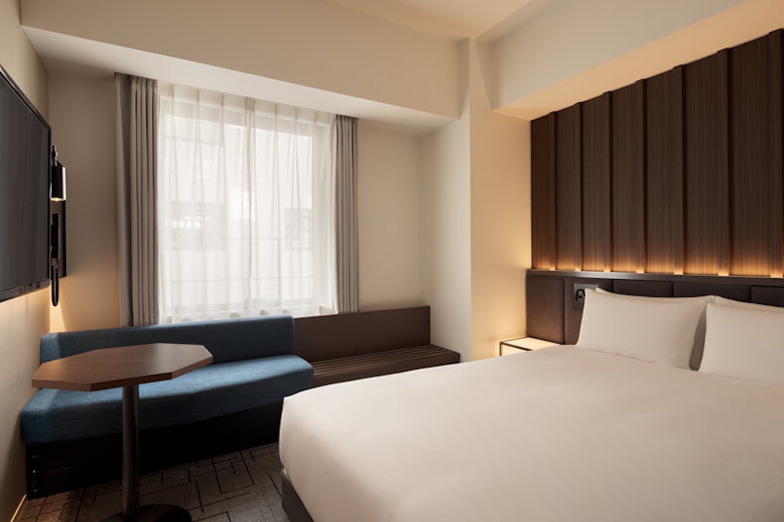 Sugata Hotel Osaka Shinsaibashi guest room with bed and window