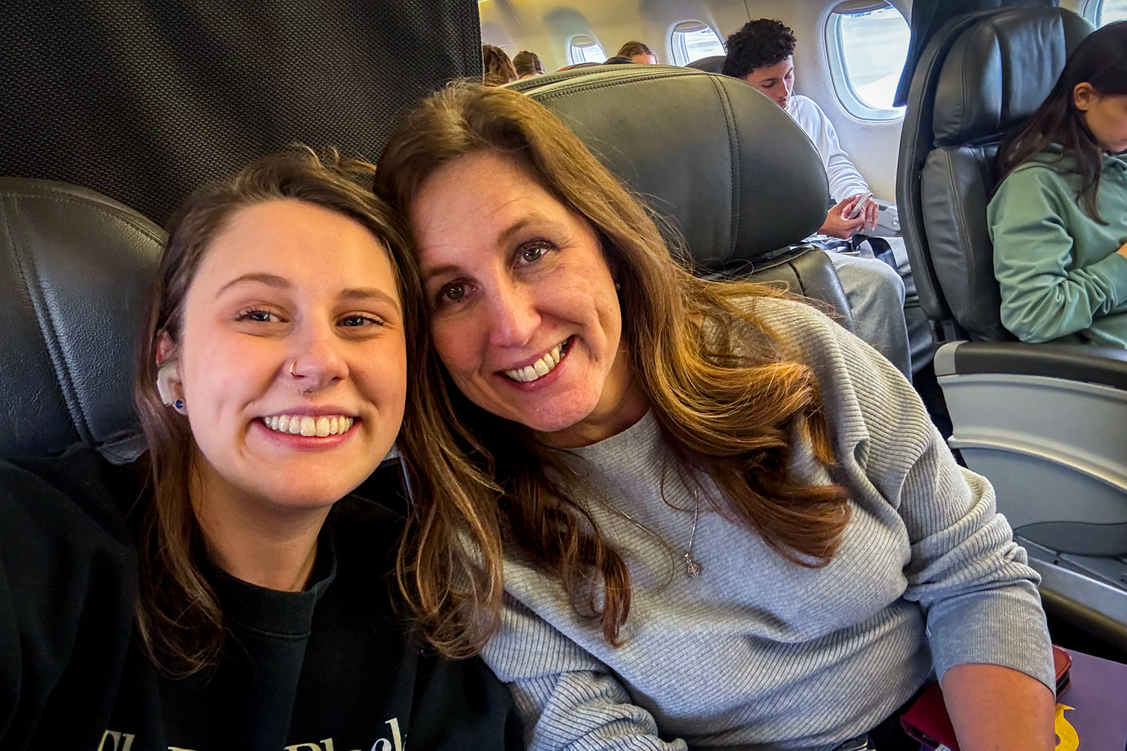 Augusta and her mom on an American Airlines plane