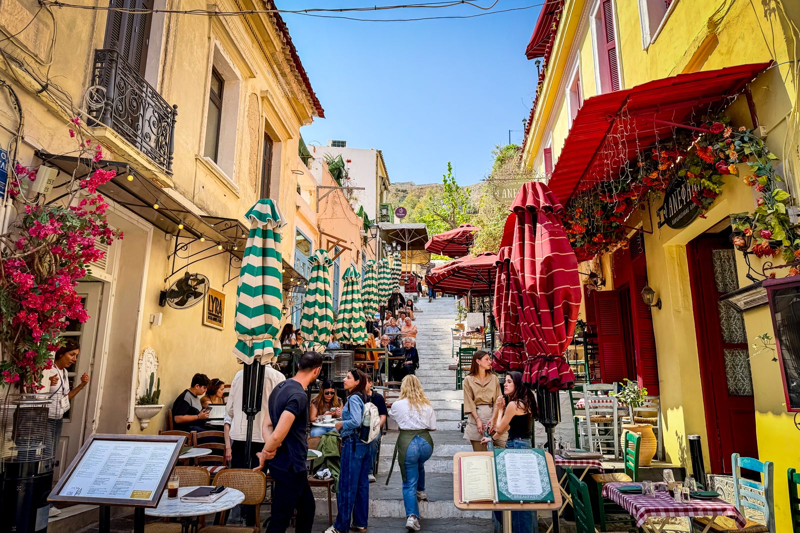 A cafe-lined passageway in Athens' Plaka District.