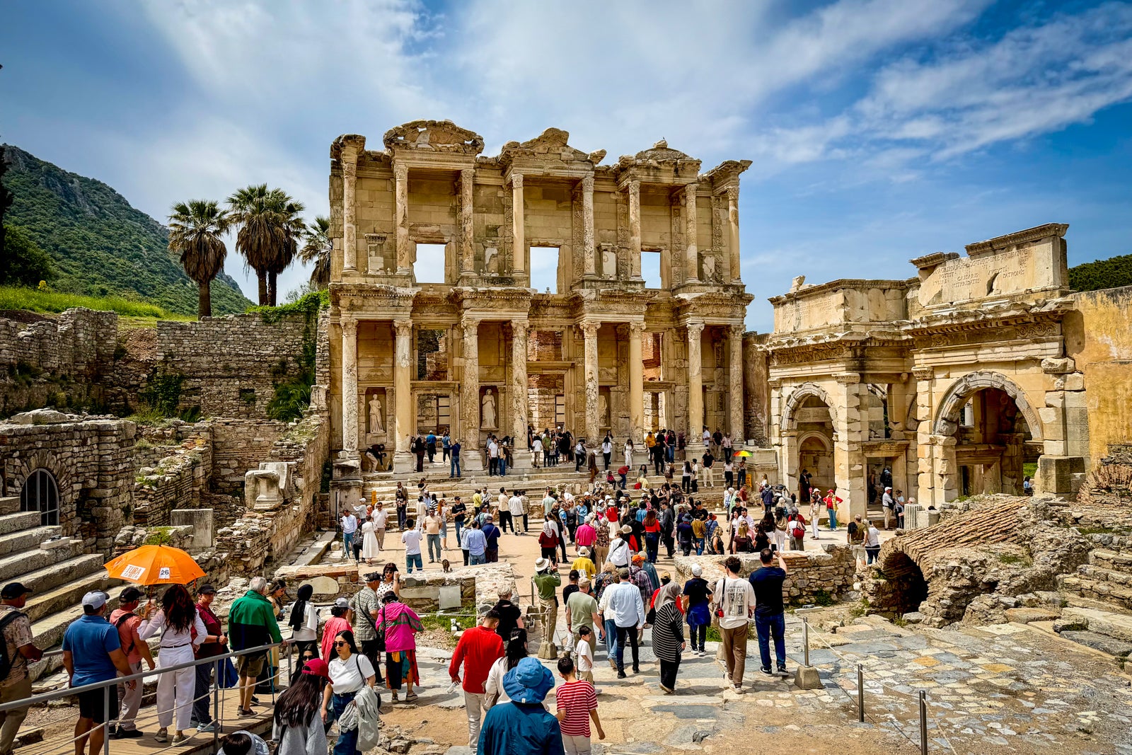 Tourists visiting the ruins of Ephesus.
