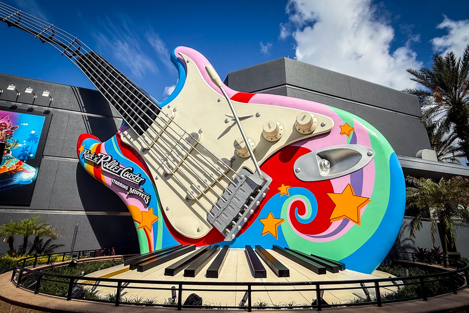 large guitar outside of a roller coaster