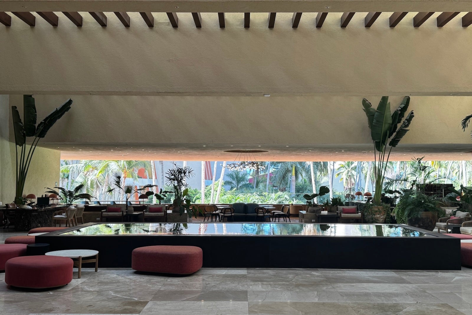 Westin playa vallarta sunlit lobby with plants and water feature