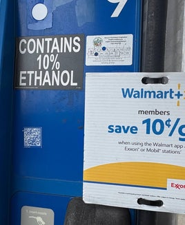 Walmart+ gas sign on the pump at an ExxonMobil