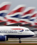 A British Airways plane lands at Heathrow Airport
