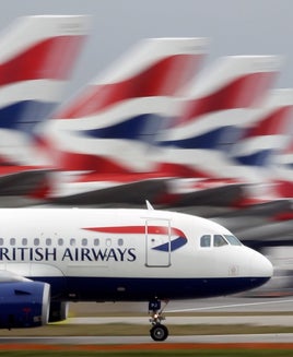 A British Airways plane lands at Heathrow Airport