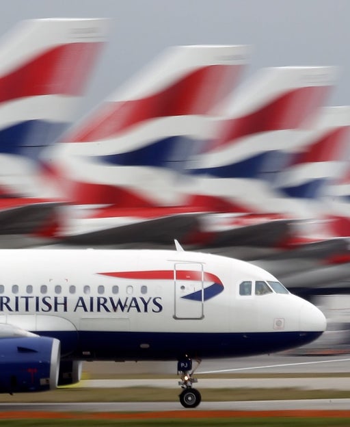 A British Airways plane lands at Heathrow Airport