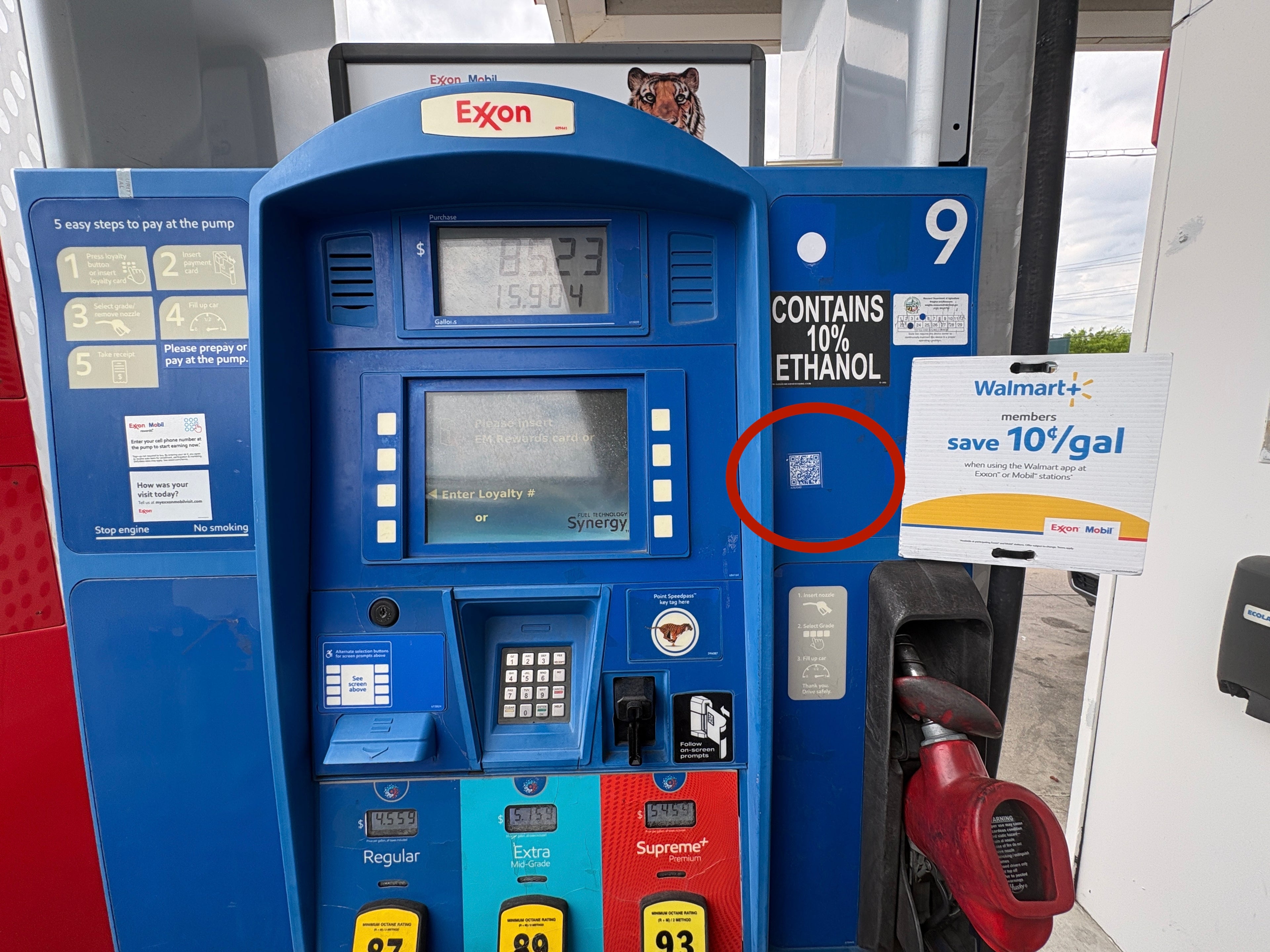 Walmart+ gas sign and unmarked QR code.