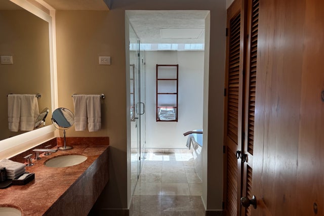 Bathroom with marble counter top and afternoon sunlight at West Playa Vallarta
