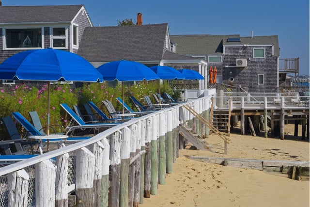 Boardwalk and beach houses along Provincetown beach and harbor
