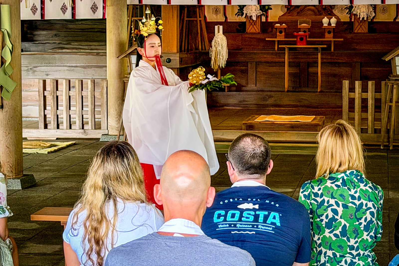 Diamond Princess passengers take in a ceremony at the Miho Shrine in Mihonoseki.