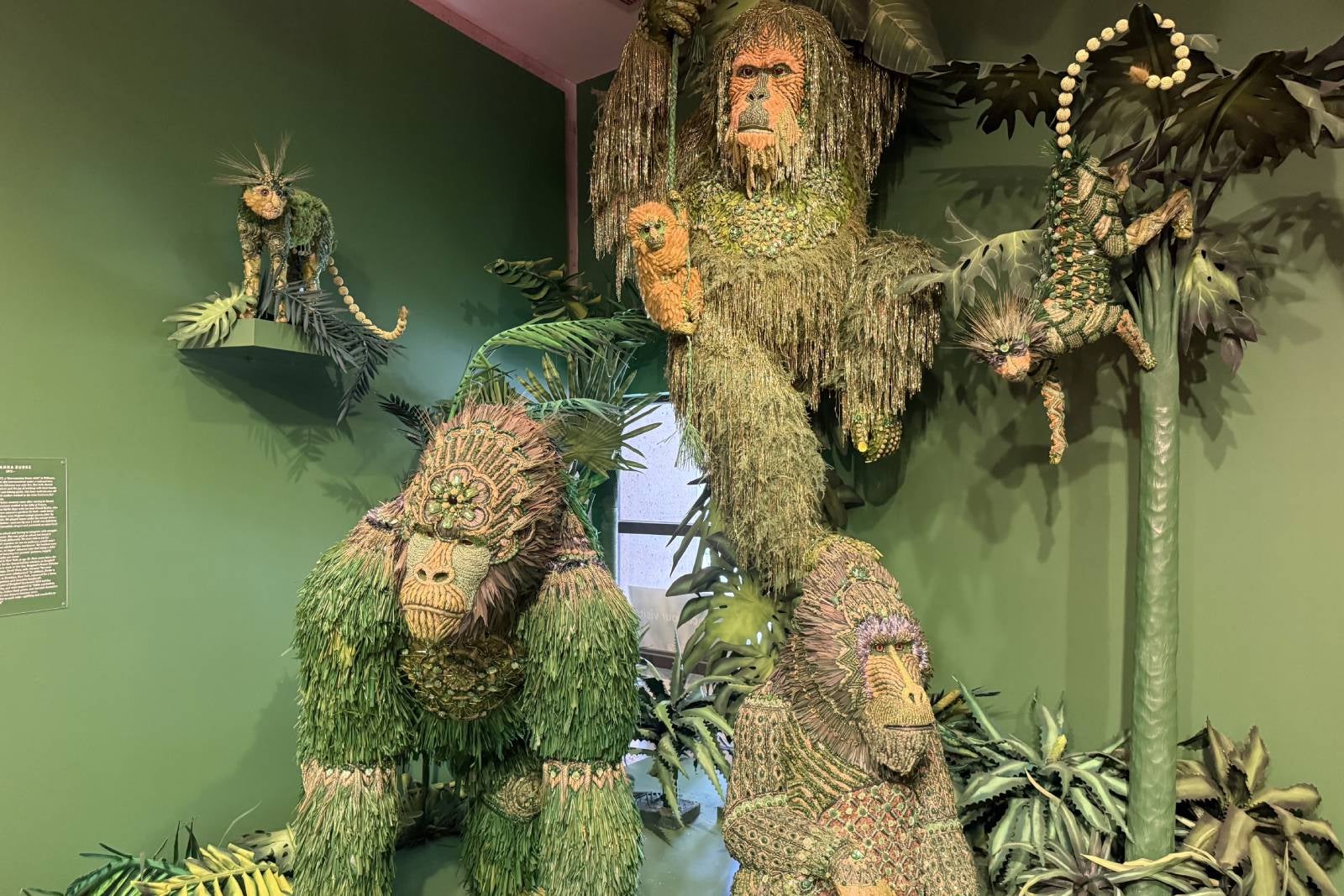 green monkey statues in art museum