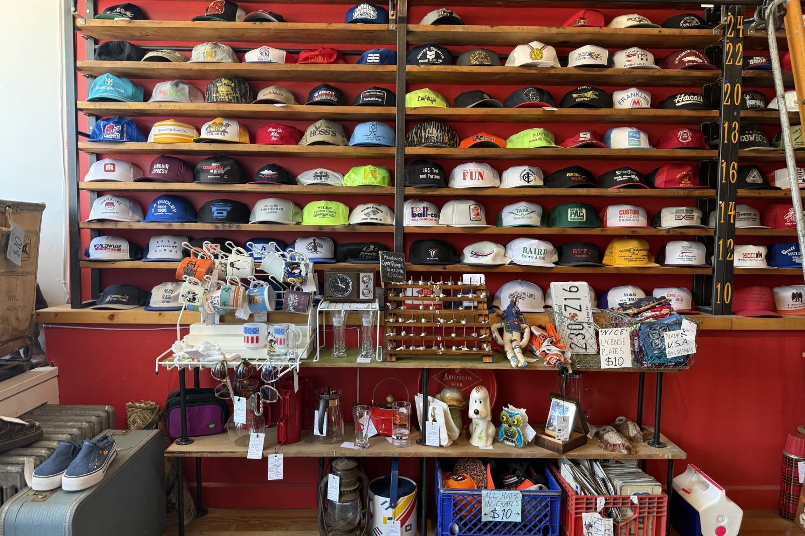 wall of vintage hats on shelves