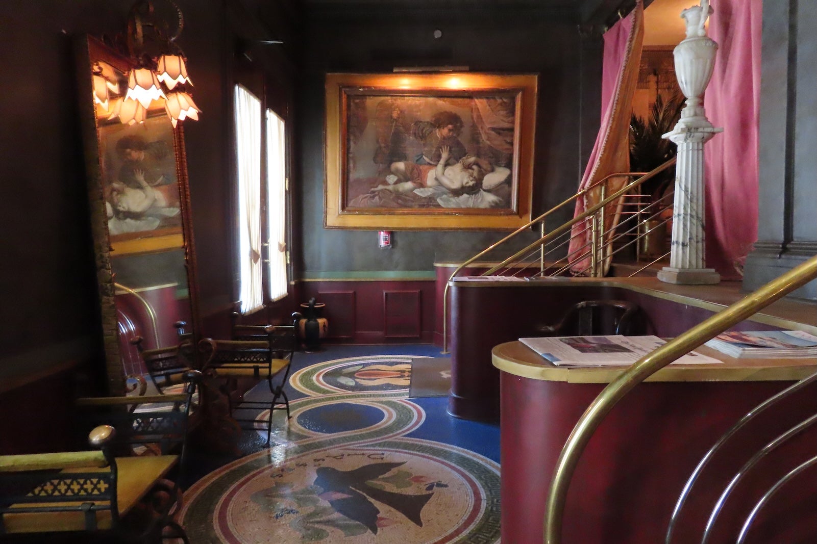 hotel lobby with tile floor and dramatic art