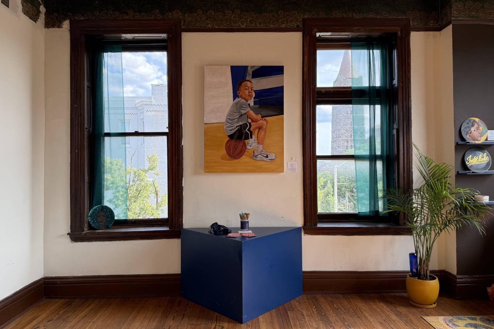 house interior with painting of boy sitting on basketball