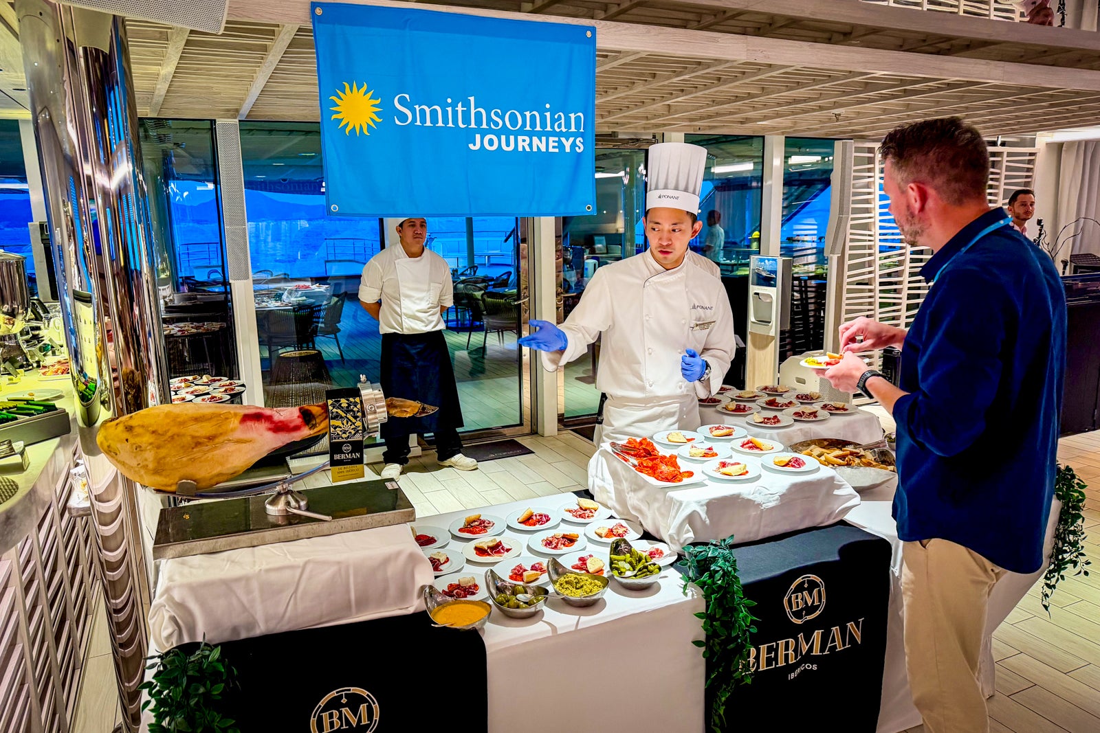 An Iberico ham tasting during cocktail hour on board Le Dumont d'Urville.