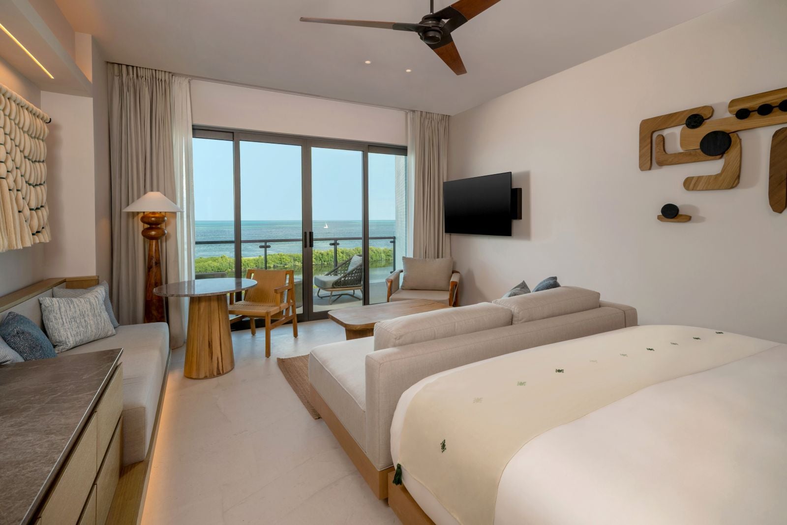 king bedroom with balcony overlooking ocean