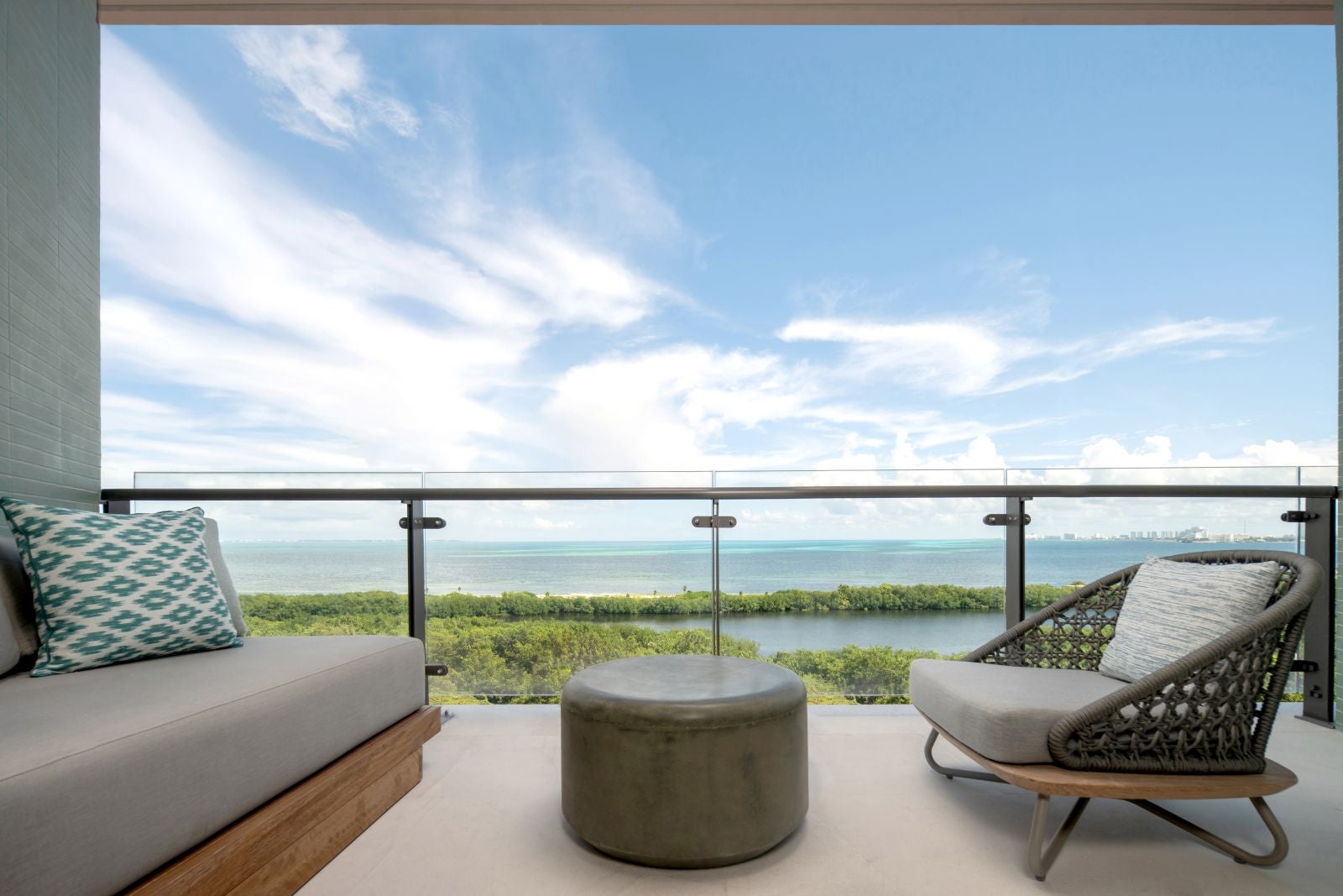 furnished hotel room balcony with ocean view