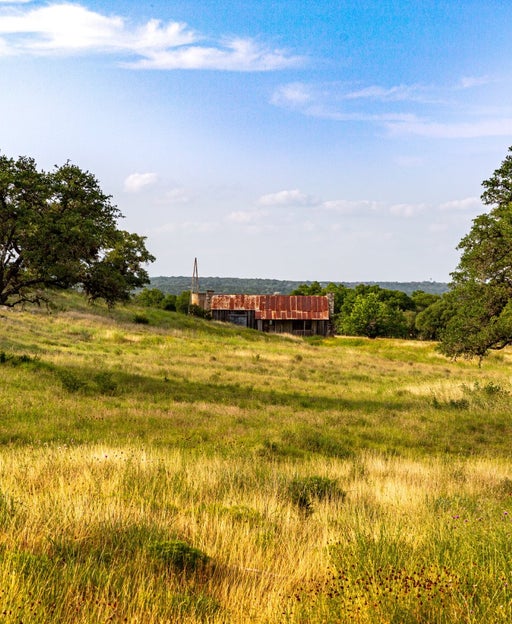 Texas Ranch with rolling hills in Wimberley Texas. Vacant Texas Ranch with Texas Hill Country landscape.