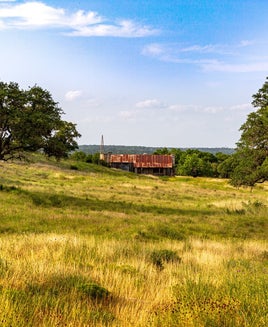 Texas Ranch with rolling hills in Wimberley Texas. Vacant Texas Ranch with Texas Hill Country landscape.