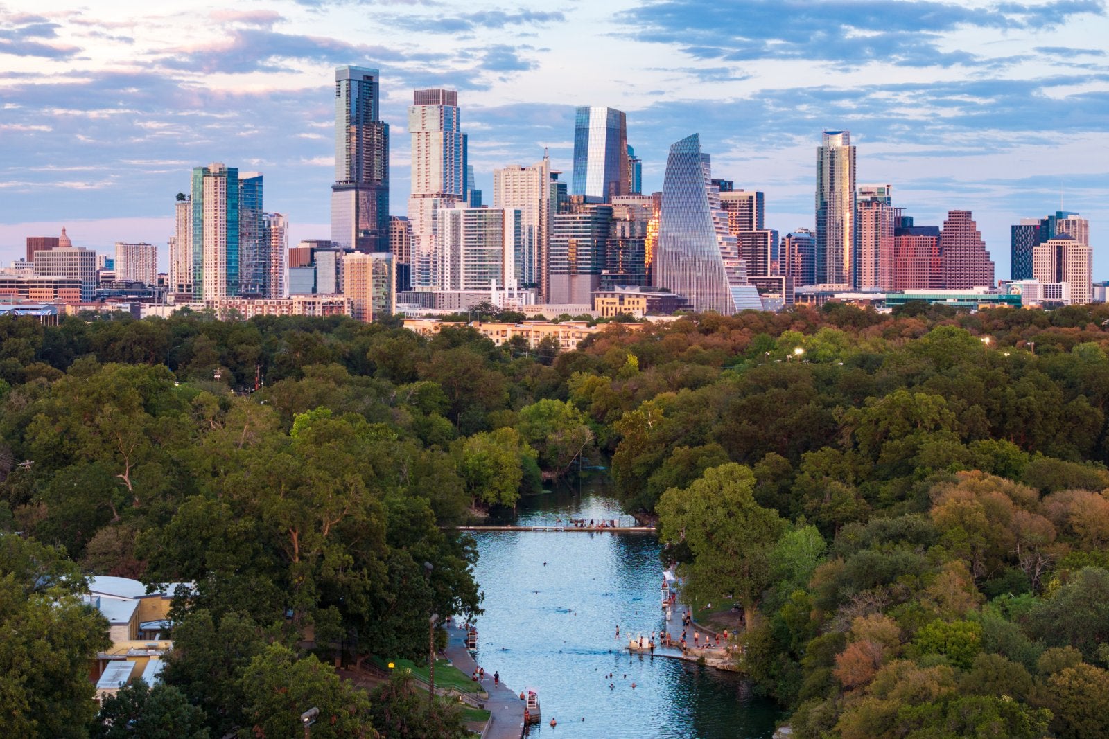 Barton Springs swimming pool with Austin's skyline in the background.