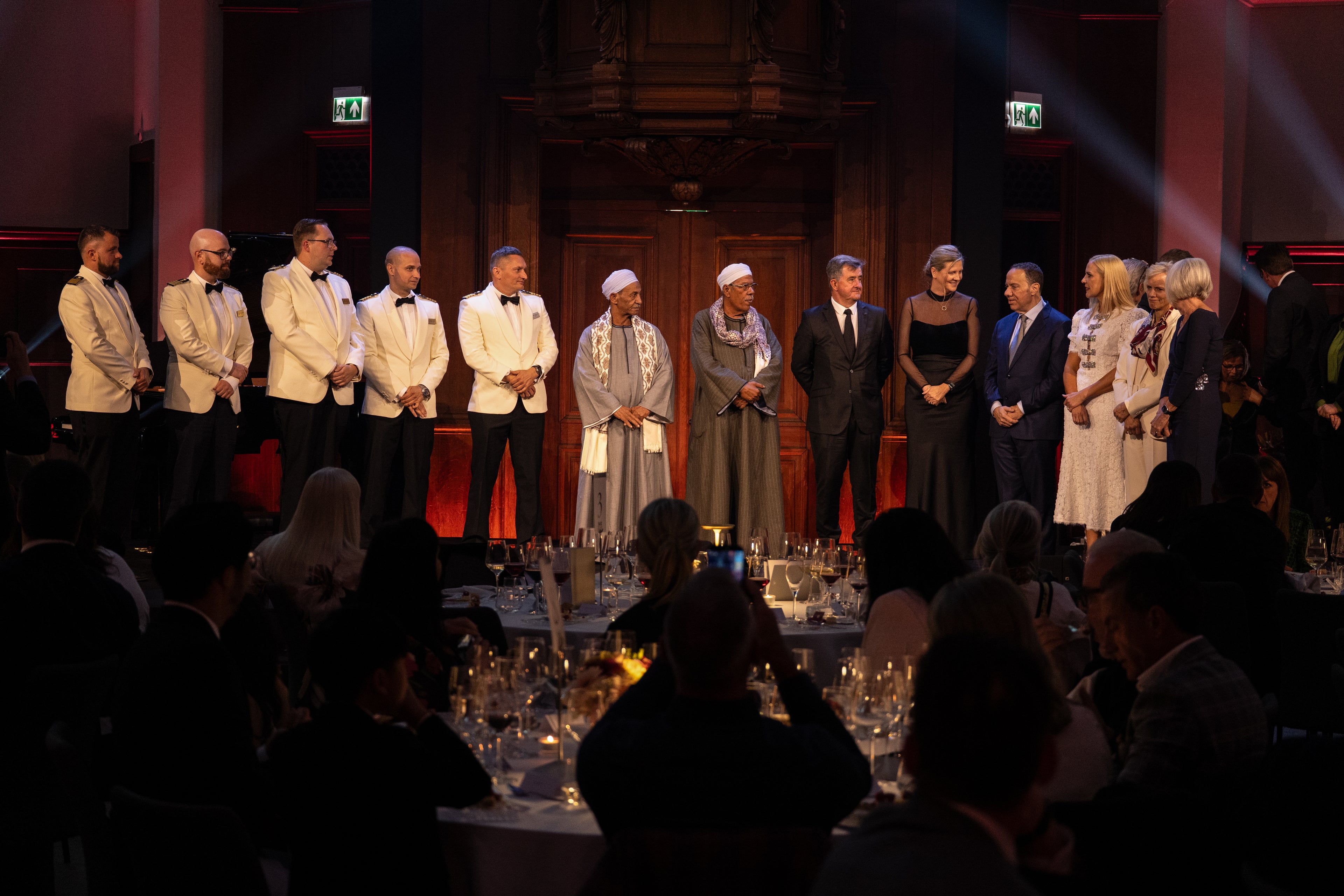 Godparents and captains for seven Viking ships assemble on stage