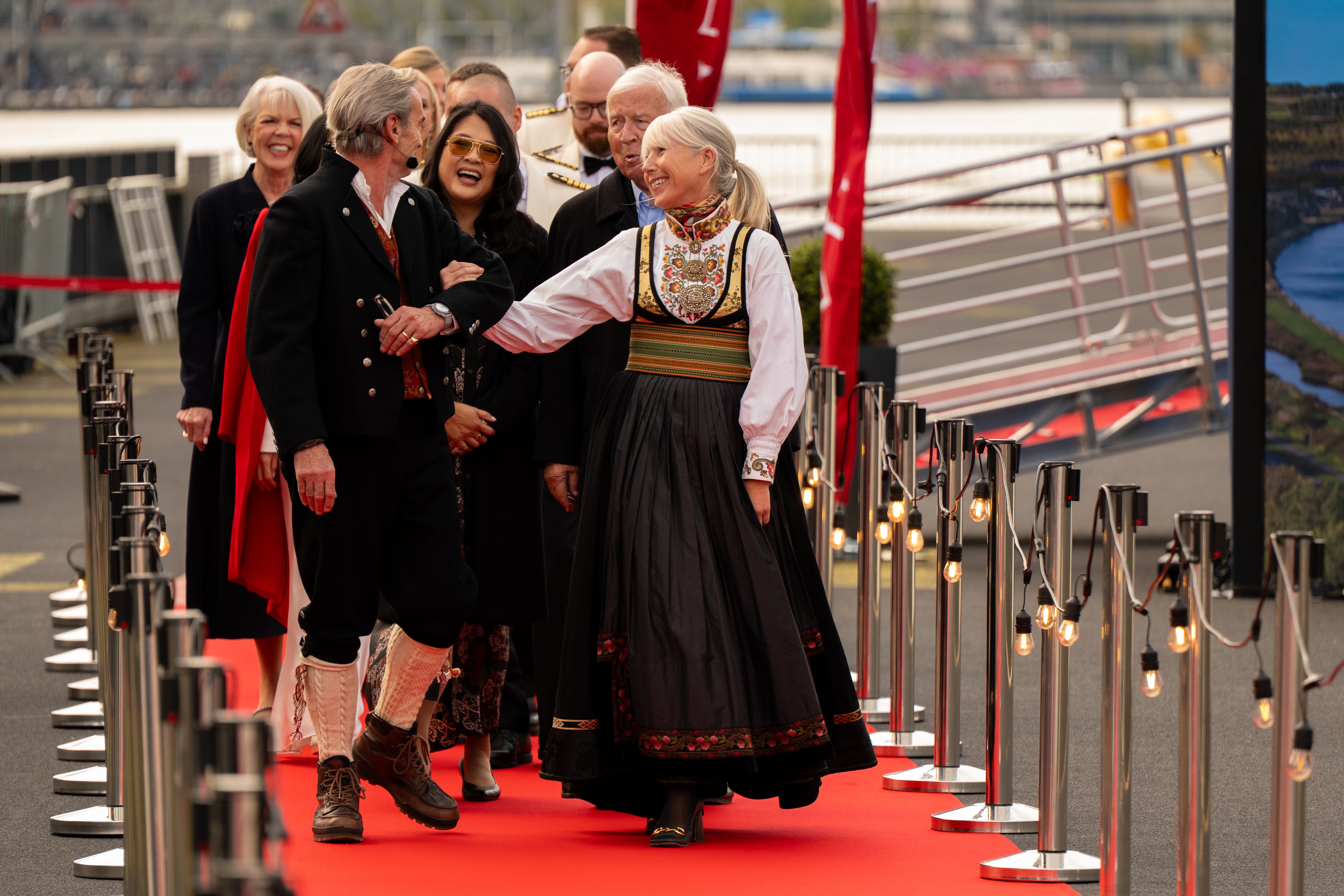 Viking executives and ship godparents arrive at a Viking christening ceremony in Amsterdam
