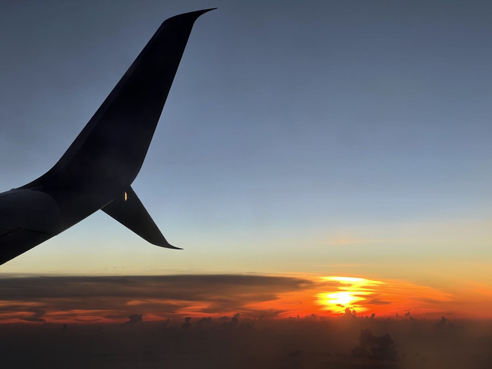 Sunset on a Delta flight on approach to Cancun International Airport
